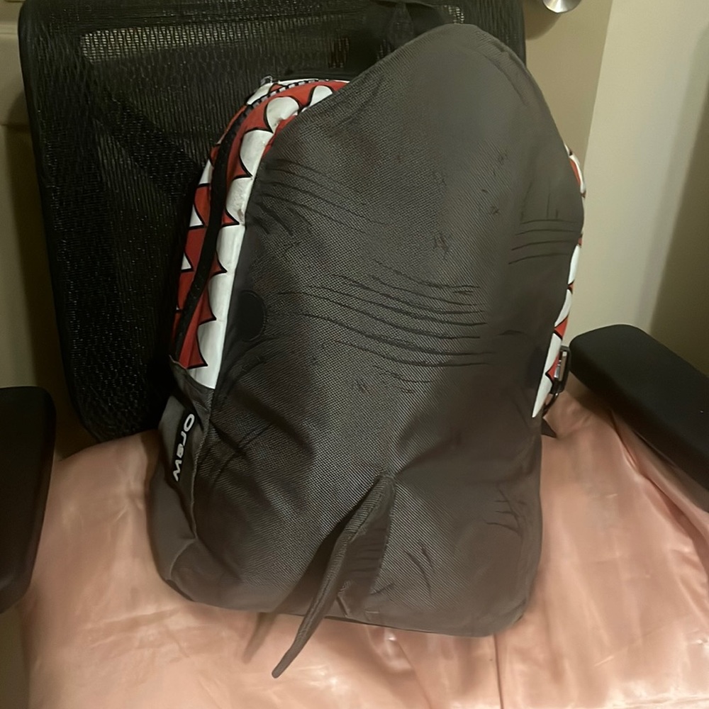 Full size shark back pack. Has zipper to put laptop/iPad & Unisex. Brand MOJO